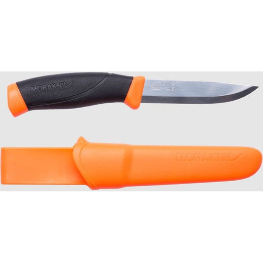 A top-down view of the Morakniv Companion Leaf Color Mix knife with its orange sheath, showing the black and orange handle and sharp blade against a white background.