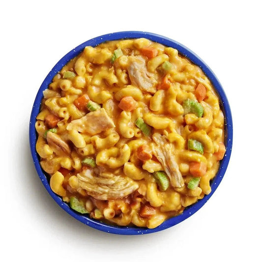 Top-down view of the Mountain House Buffalo Style Chicken Mac and Cheese in a blue bowl against a white background.