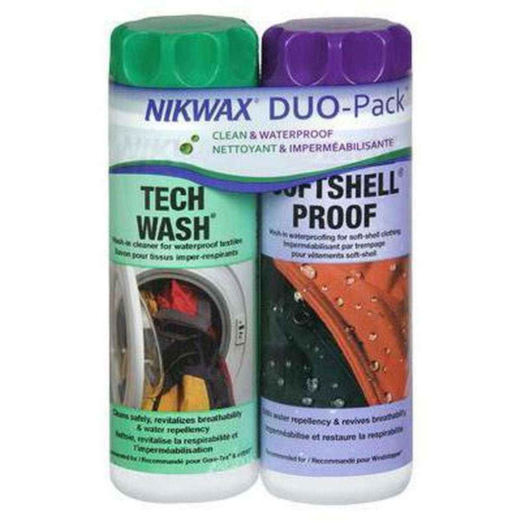 Two bottles of Nikwax Duo-Pack cleaning products, one green-capped Tech Wash and one purple-capped Softshell Proof, are shown side by side against a white background.