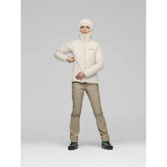 A model wearing the Norrona Women's Femund Thermo60 Zip Hood in Caviar Black stands against a light gray background.