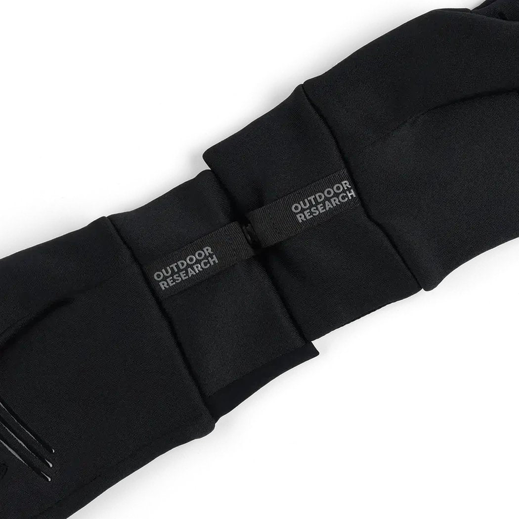 A close-up of the black Outdoor Research Men's Vigor Midweight Sensor Gloves showing the brand labels and stitching against a white background.