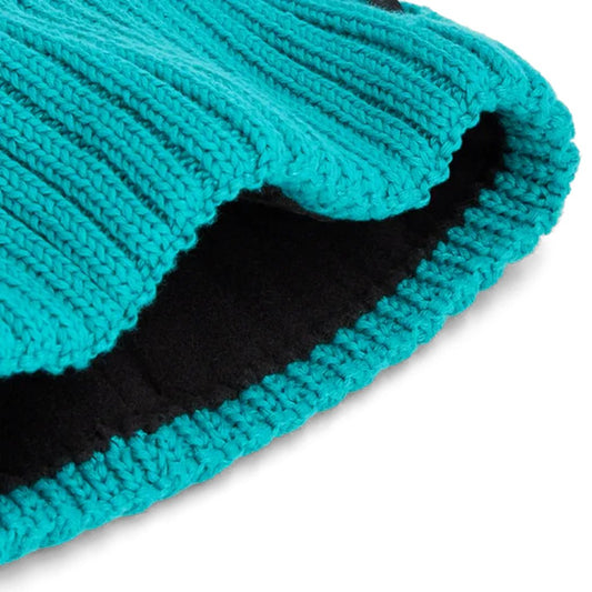 A close-up of the Outdoor Research Women's Liftie Beanie in Tidepool/Aurora showing the ribbed knit and black inner lining against a white background.