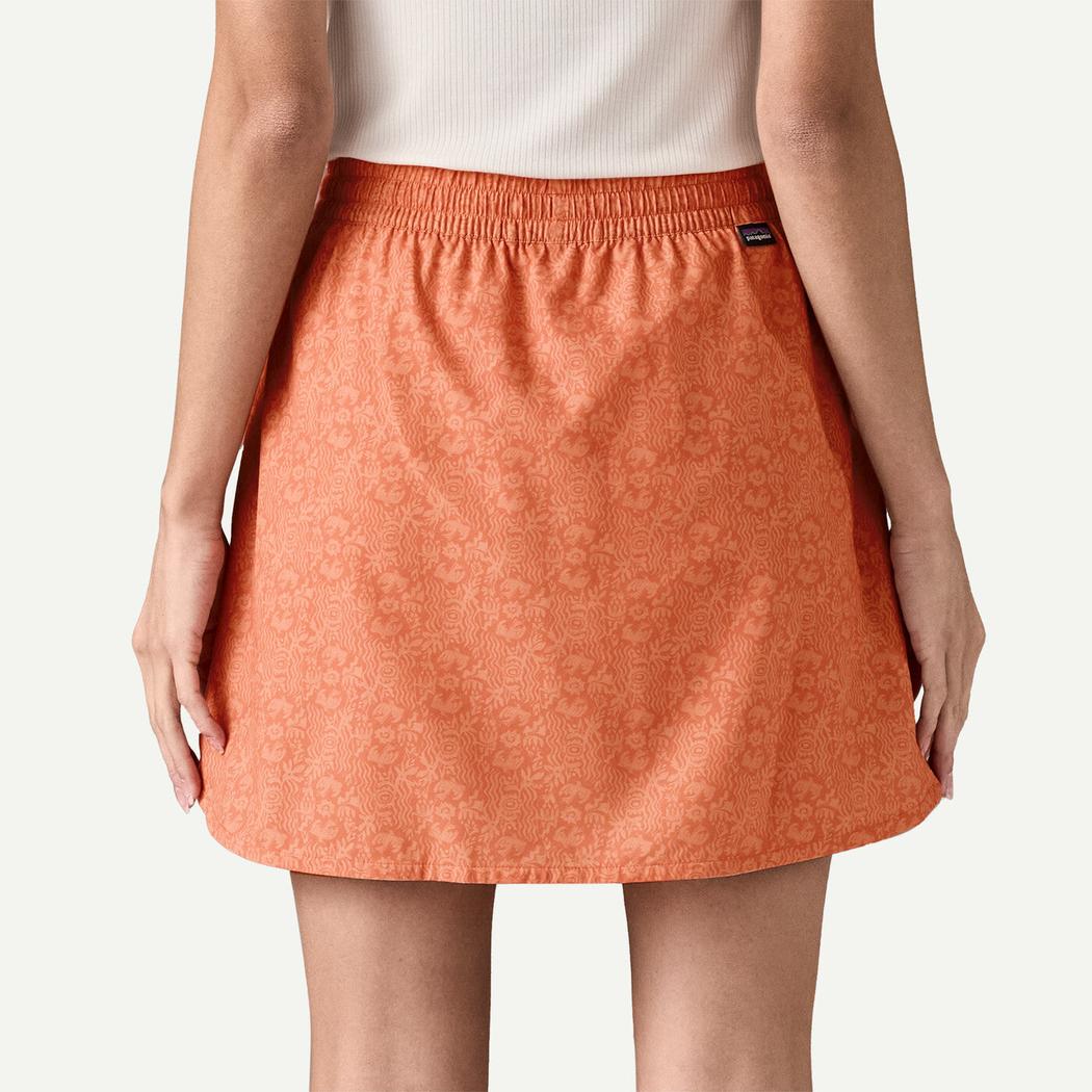 Back view of the Patagonia Women's Fleetwith Skort in Mountain Breeze: Rock Melon against a white background.