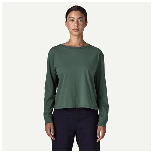 A front view of the Patagonia Women's Long Sleeve Daily Easy Cut T-Shirt in Diver Blue on a model against a light background.