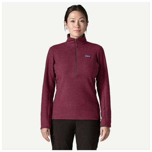 A front view of the Patagonia Women's R1 Air Zip Neck in Berry Fig showing the half-zip collar and the model wearing it against a plain white background.
