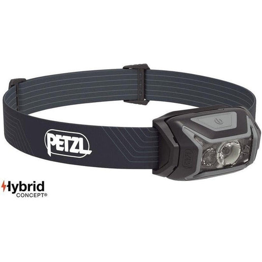 Side view of the Petzl Actik headlamp in Green showing the adjustable strap and light head against a white background.