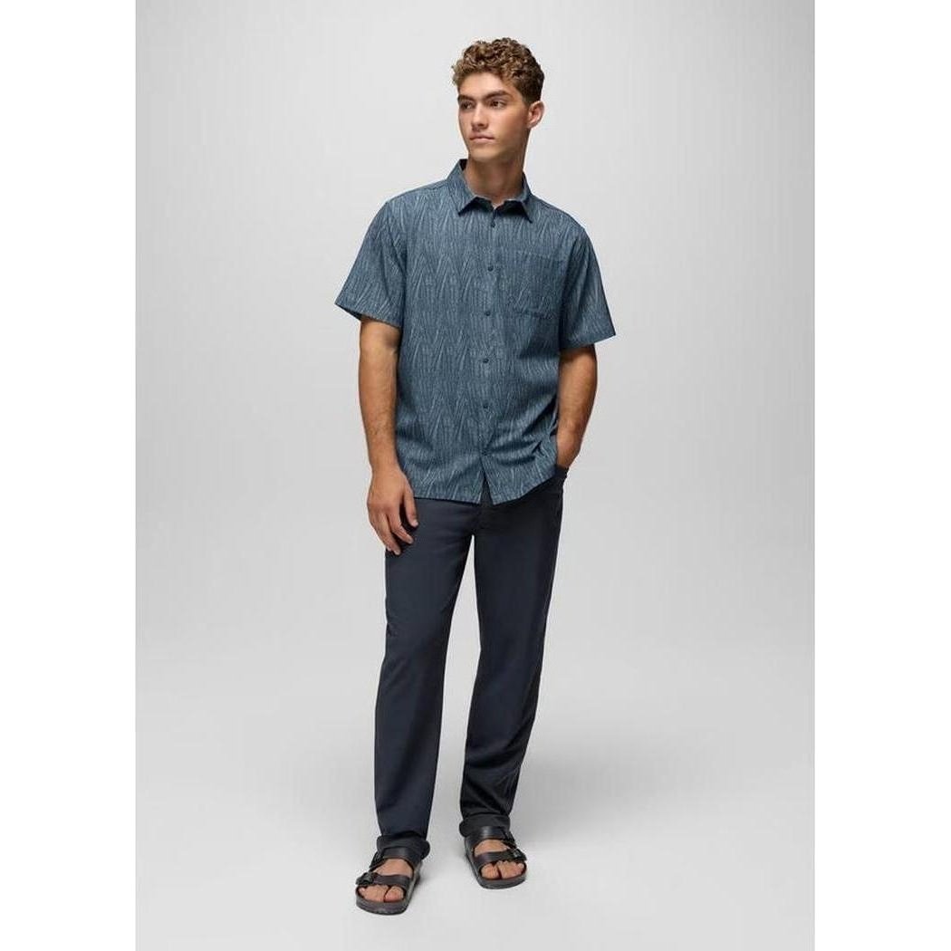 A front view of the Prana Men's Hybridizer SS Shirt in Bluff Blue Seashell worn by a model against a light gray background.