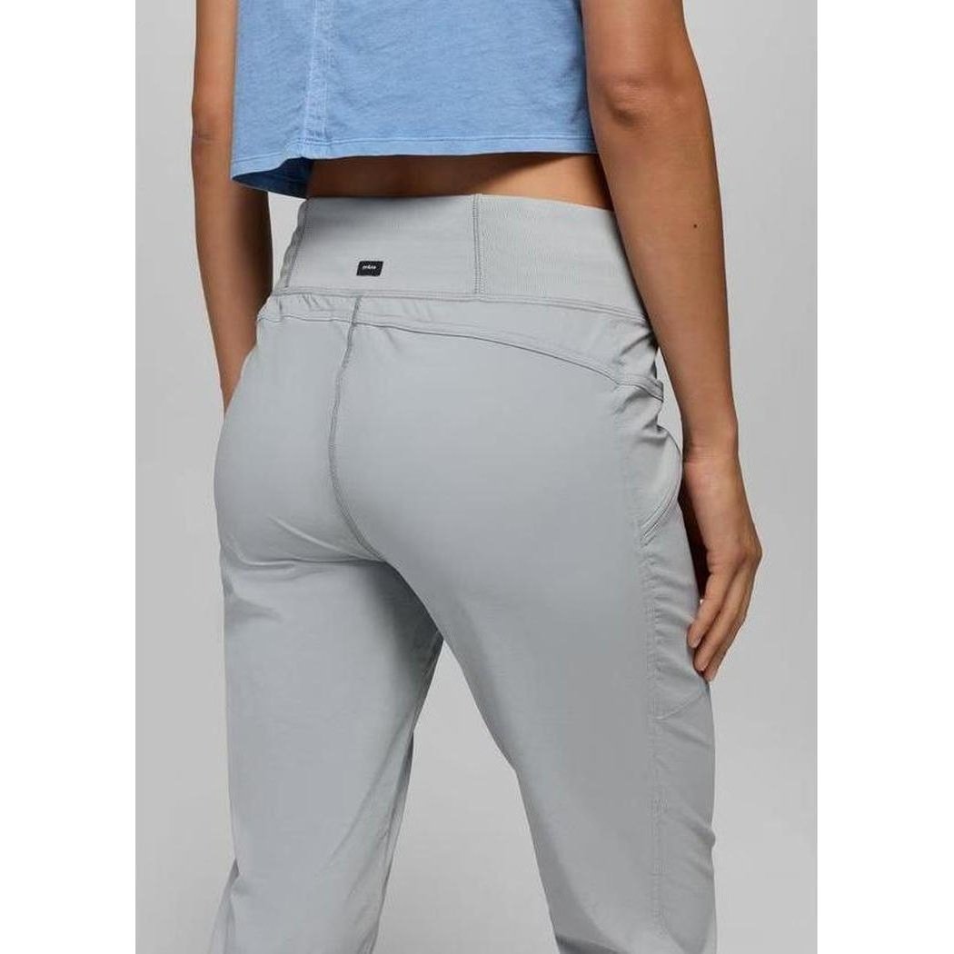 Back view of the Prana Women's Koen Mid Rise Daily Pant in Grey Blue showing the high waist and back pocket against a plain background.