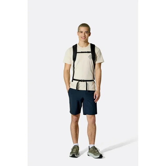 A front view of the Rab Adrift 30 backpack in Black on a model wearing it against a white background.