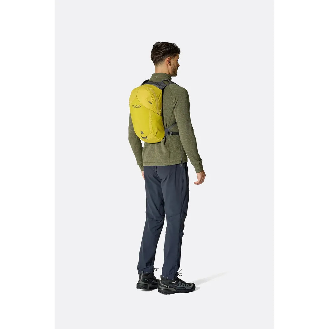 Back view of the Rab Tygen 12 backpack in Black worn by a model against a plain white background.