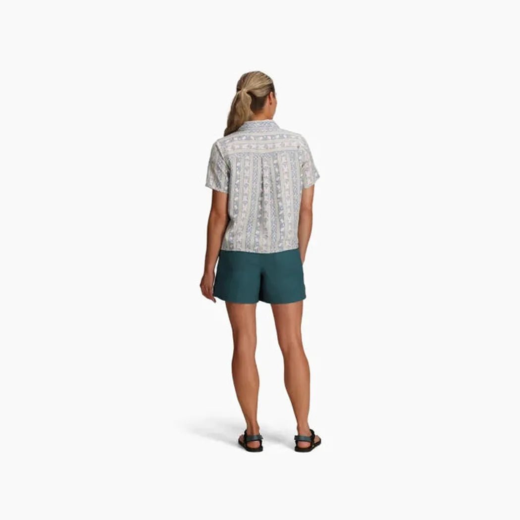 Back view of the Royal Robbins Women's Camino Pucker Short Sleeve in Skyway Ray Pt on a model against a white background.
