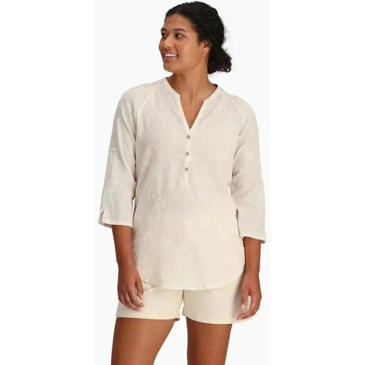 A woman wearing the Royal Robbins Women's Oasis II 3/4 Sleeve Navy top stands against a white background.