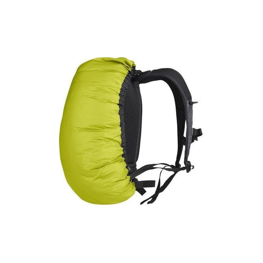 Side view of the Sea To Summit Ultra-Sil Pack Cover in Blue showing the backpack straps and a white background.