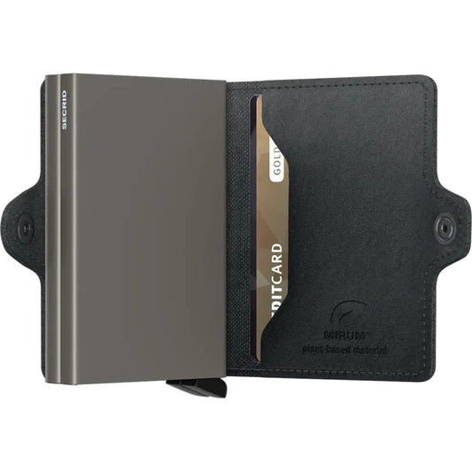 A black SECRID Twin Wallet - Mirum open to show a card slot and branding.