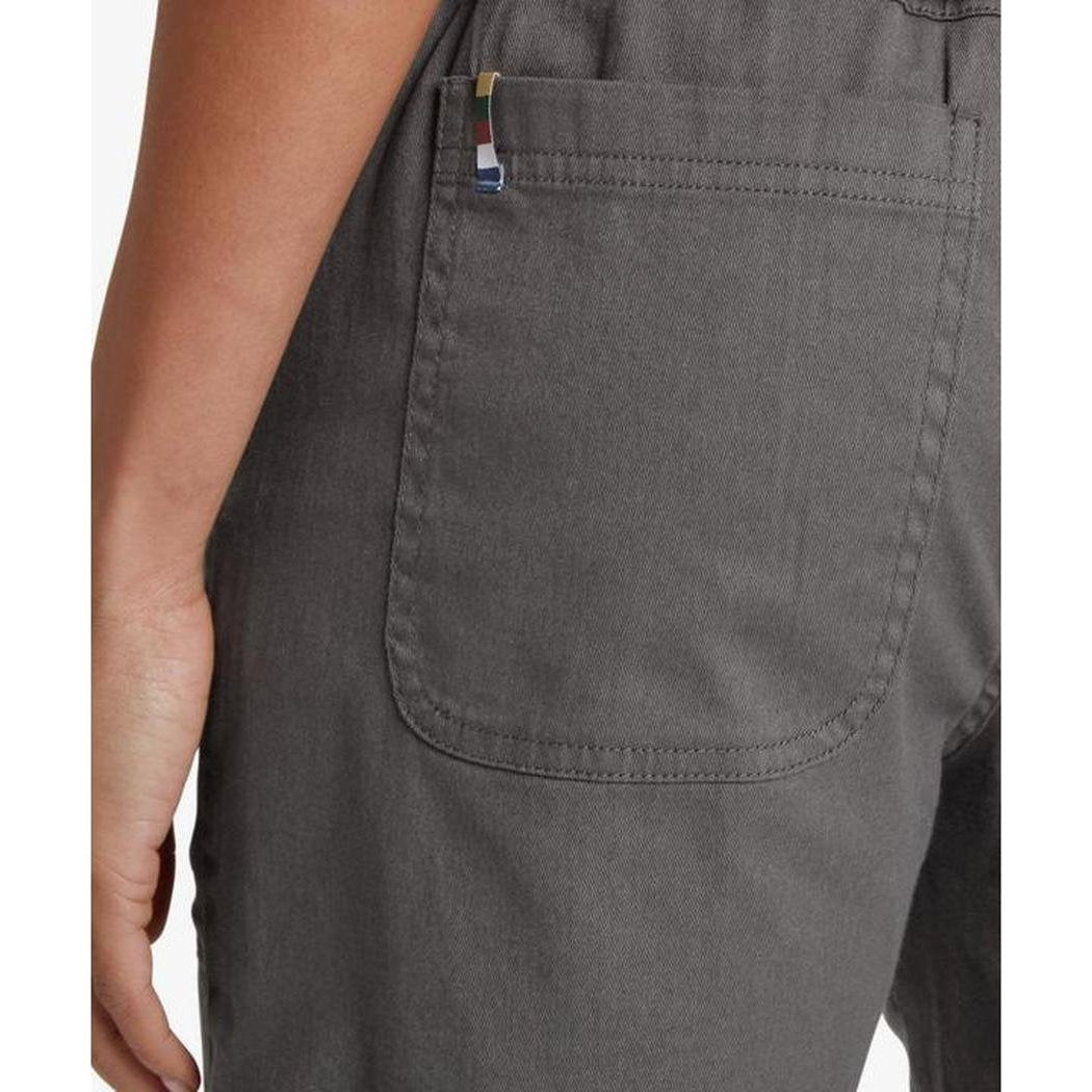 Side view of the Sherpa Adventure Gear Sample - Women's Dando Short in Evergreen showing the back pocket and model arm.