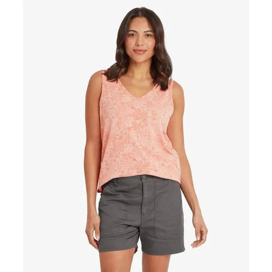 A model wearing the Sherpa Adventure Gear Women's Neha V-Neck Tank in Rose Gold stands against a plain white background.