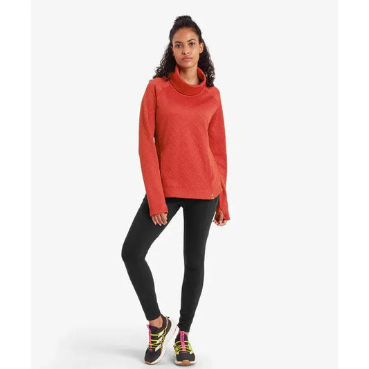 A model wearing the Sherpa Adventure Gear Women's Nyano Pullover in Ecru stands against a white background.