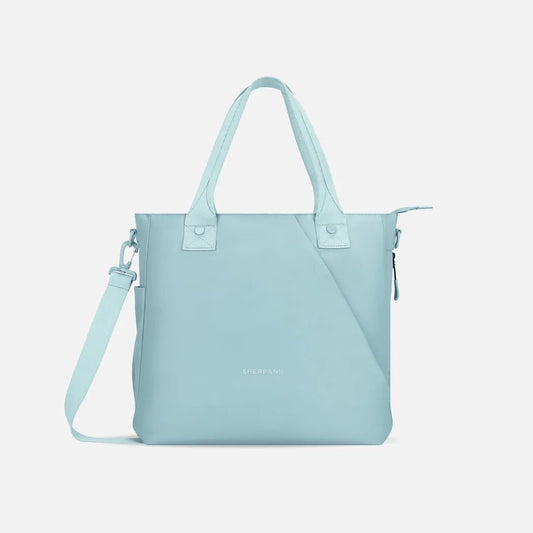 A front view of the Sherpani Jetsetter Tote in Chromatic with a shoulder strap and zipper pocket against a white background.