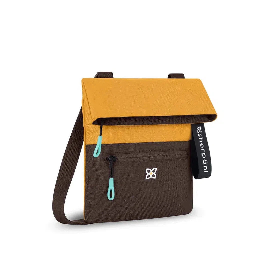 A front view of the Sherpani Pica bag in Raven color showing the front pocket and shoulder strap against a white background.