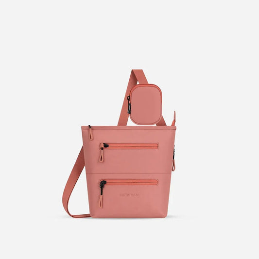 A front view of the Sherpani Sadie with Strap Pocket in Desert showing the front pockets and attached strap pocket against a white background.
