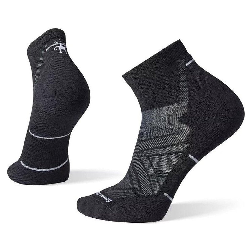 Side view of the Smartwool Run Targeted Cushion Ankle Socks in Black showing the patterned cushioning on the footbed against a white background.