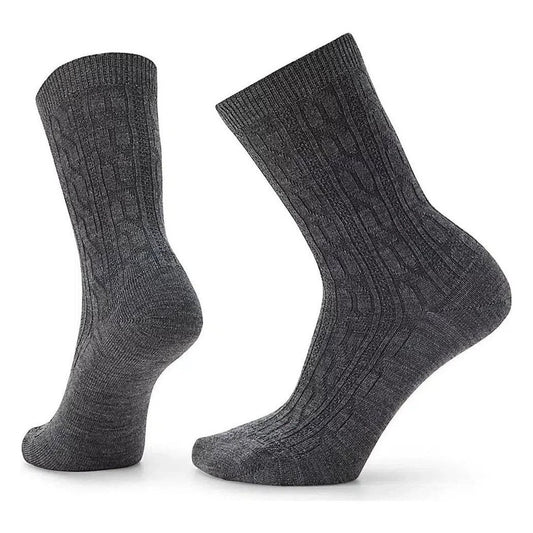 Side view of the Smartwool Women's Everyday Cable Crew Socks in Black showing the cable knit pattern against a white background.