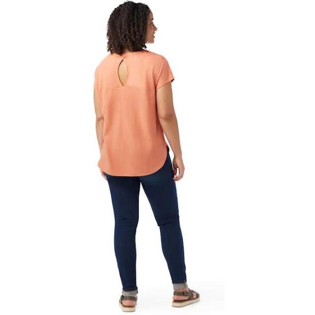 Back view of the Smartwool Women's Short Sleeve Swing Top in Almond on a model against a white background.
