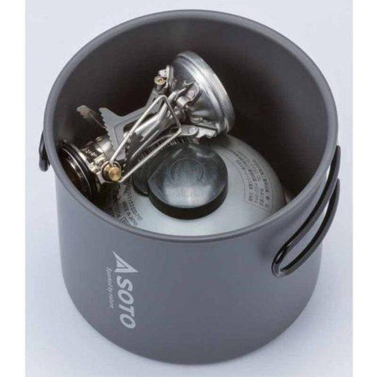 A charcoal Soto Outdoors Amicus Stove with Igniter sits inside a matching New River Pot.