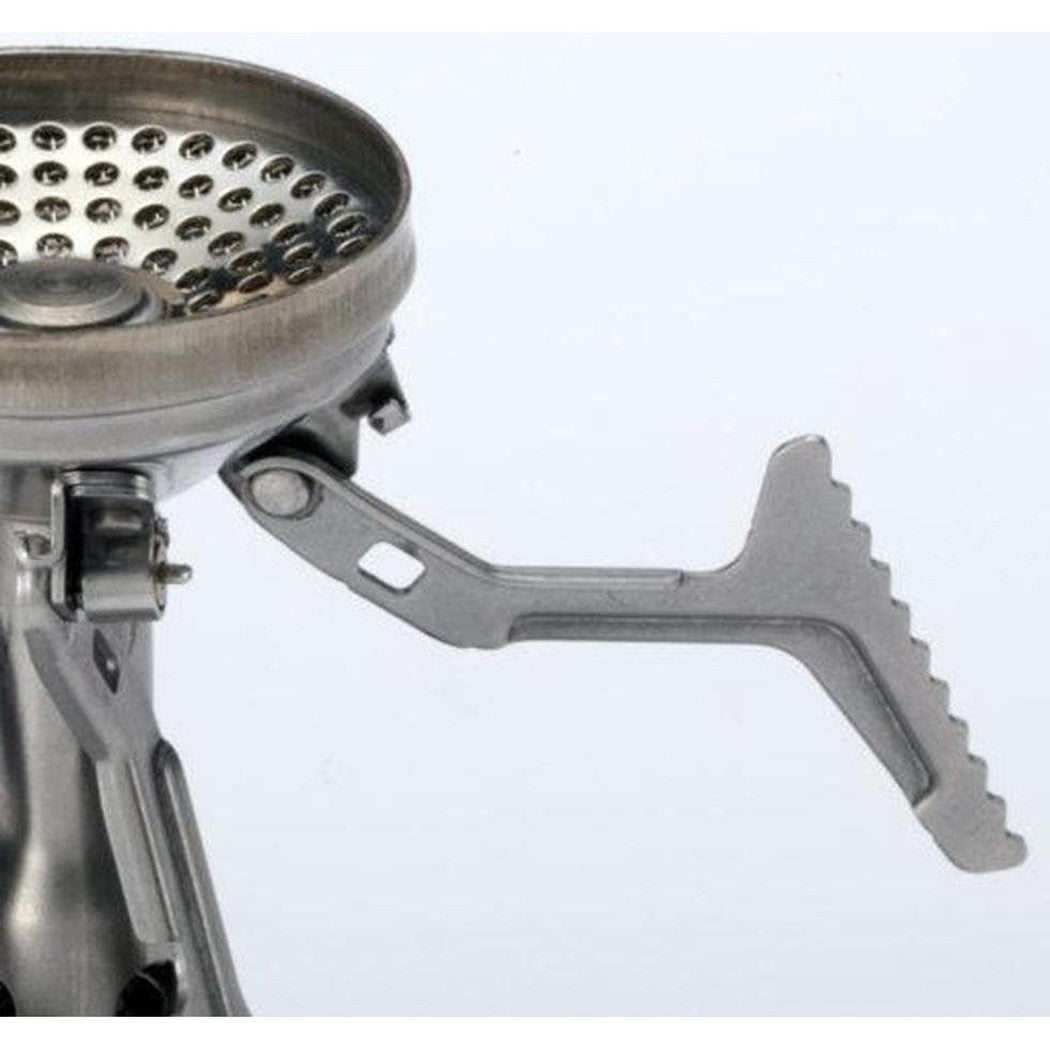 A close-up of the Soto Outdoors Amicus without Igniter stove showing its metallic burner and serrated adjustment lever against a plain white background.