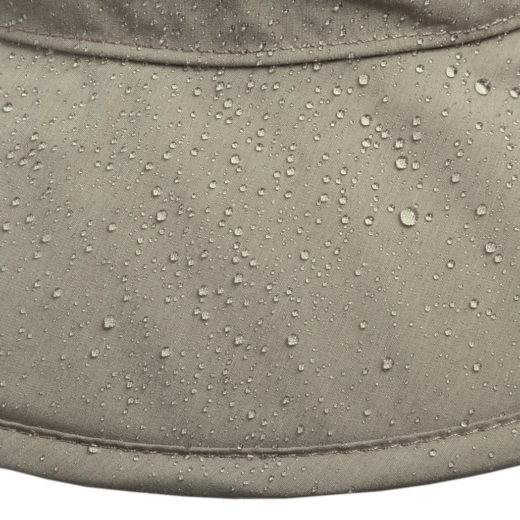 A close-up of the Sunday Afternoons Ultra Storm Bucket in Carbon showing water droplets on the fabric and stitching details.