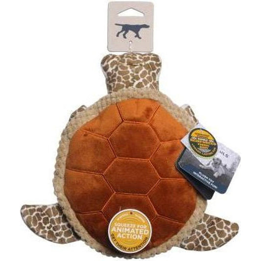 A front view of the Tall Tails Animated Sea Turtle Dog Toy with a brown shell and giraffe-patterned head and flippers, showing the "Squeeze for Animated Action" tag.