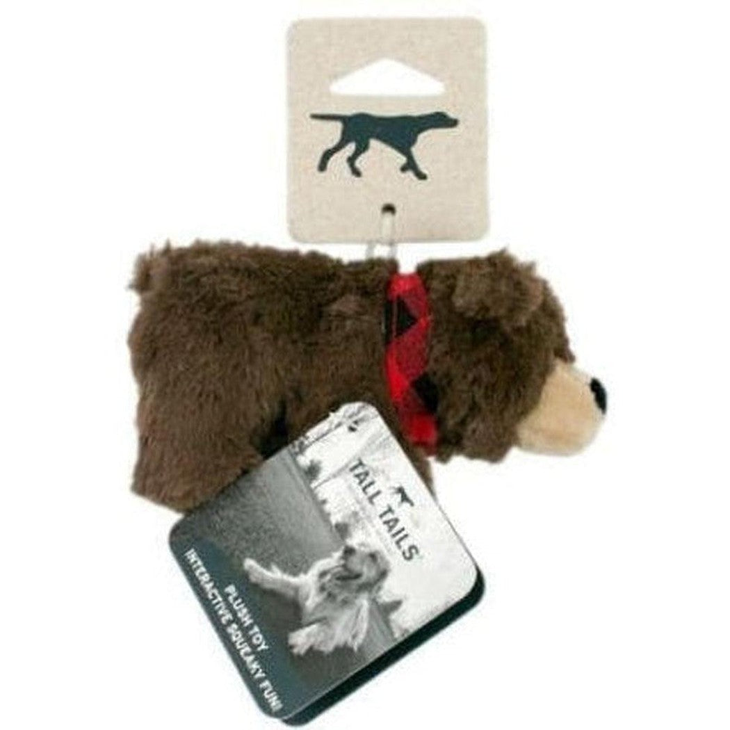 A front view of the Tall Tails Baby Bear With Squeaker toy showing the red plaid bow tie and the "Tall Tails" tag against a white background.