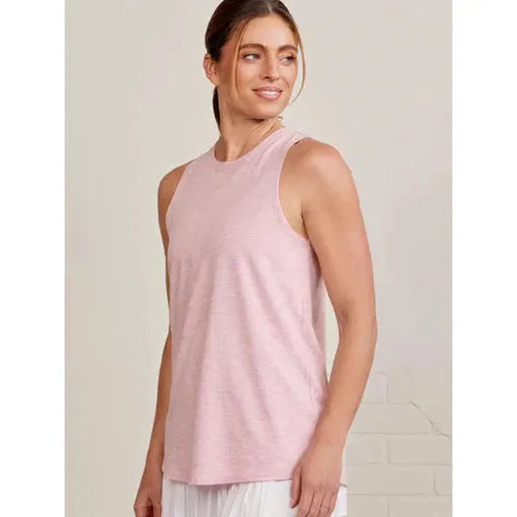 Side view of the Tasc Women's Nola Tank 2.0 in Heritage Blue on a model against a light background.