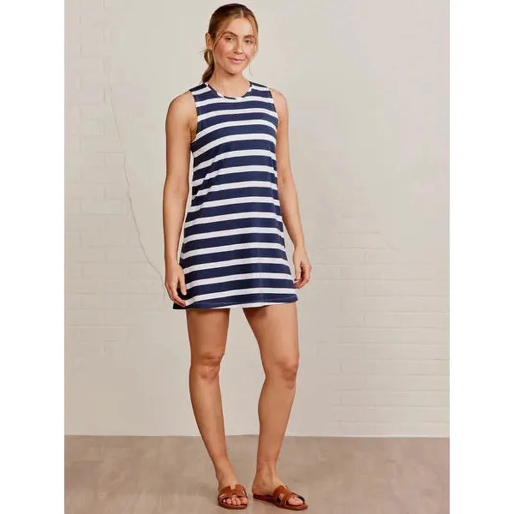 A woman wearing the Tasc Women's Summer Tank Dress Stripe in Classic Navy White stands against a light background.