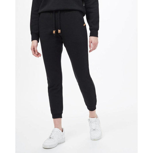 A front view of the Tentree Women's TreeFleece Bamone Sweatpant in Meteorite Black on a model wearing white sneakers against a white background.