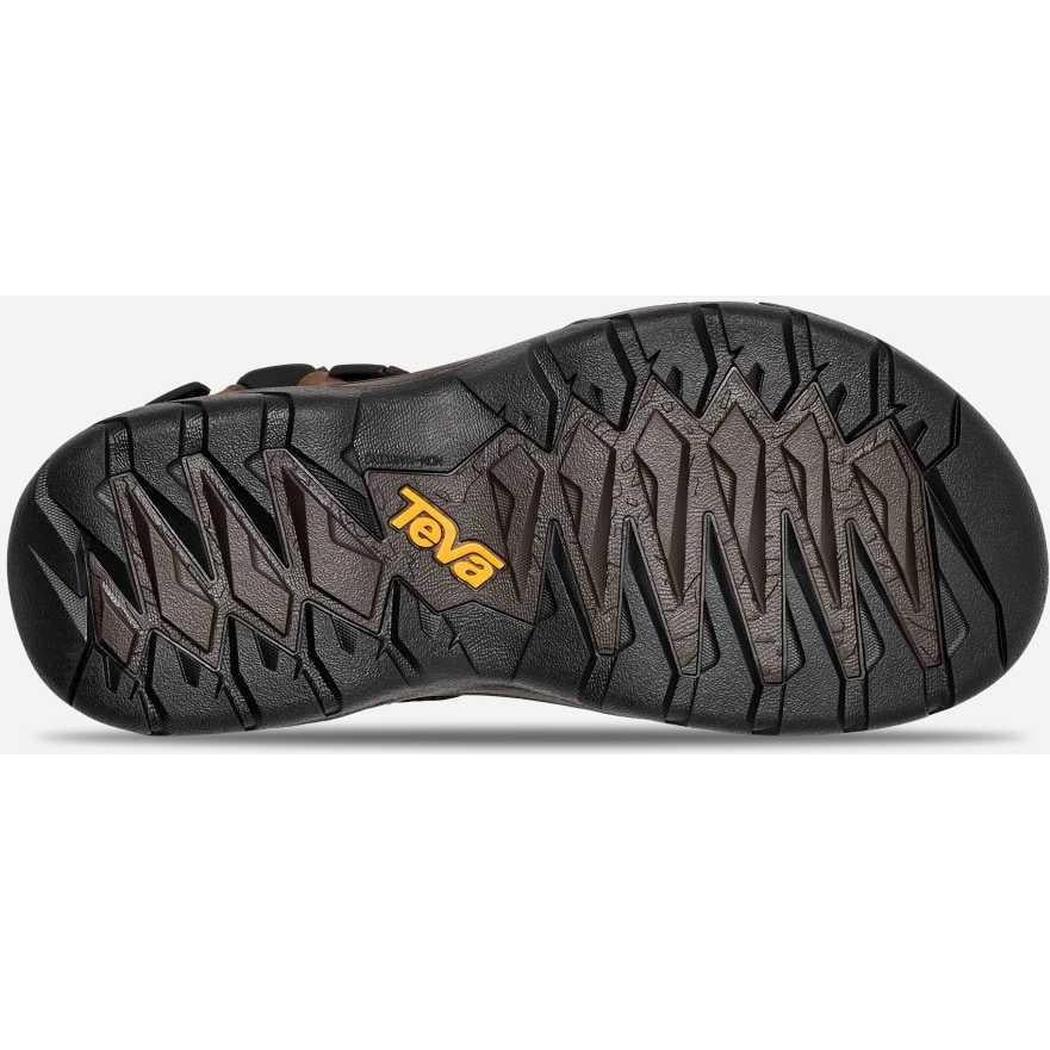 The sole of a Teva Men's Terra FI 5 Universal Leather sandal in Turkish Coffee, showing the lugged tread pattern from a bottom-down angle against a white background.