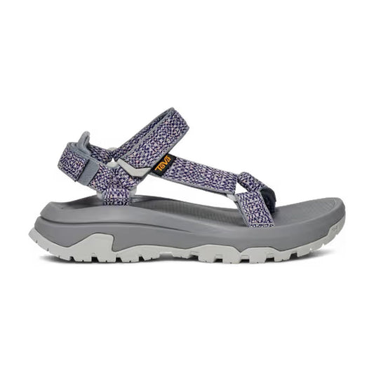 Side view of the Teva Women's Hurricane XLT3 in Criss Cross Bossa Nova showing the adjustable straps and thick outsole against a white background.
