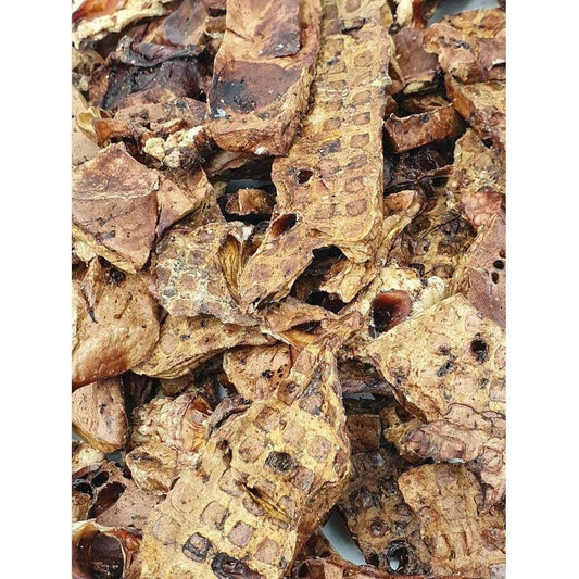 Close-up of Tickled Pet All Natural Lamb Lung treats showing their textured, brown appearance.