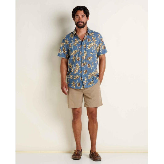 A model wearing the Toad & Co Men's Salton Short Sleeve Shirt in Pacific Blue Print stands against a plain white background.