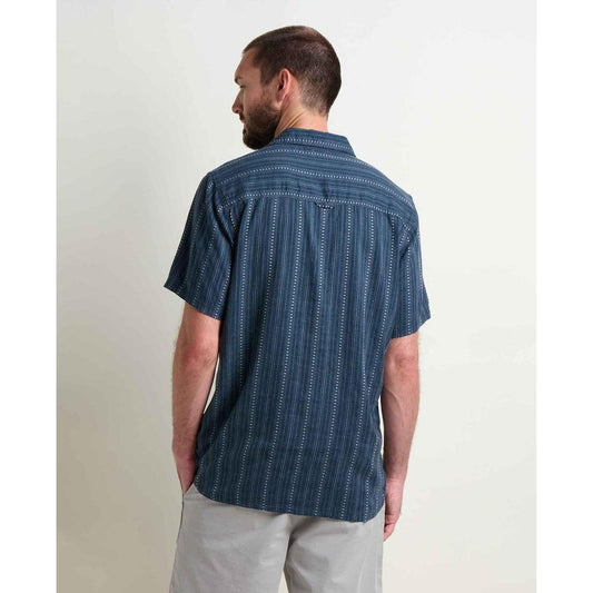 Back view of the Toad & Co Men's Taj Hemp Short Sleeve Shirt in Midnight Dobby on a model wearing light gray shorts against a plain white background.