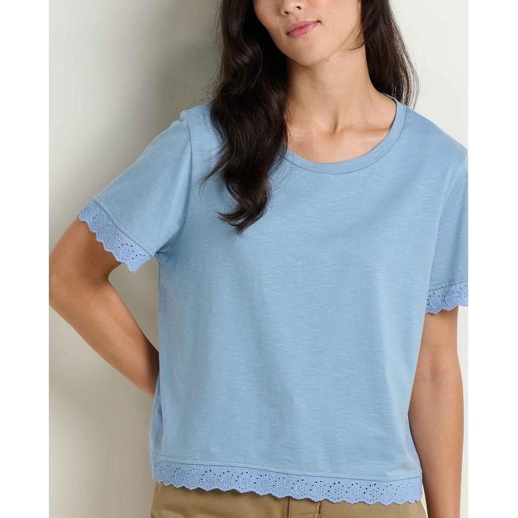 A front view of the Toad & Co Women's Clara Tee in Weathered Blue showing the lace trim on the sleeves and hem against a neutral background.