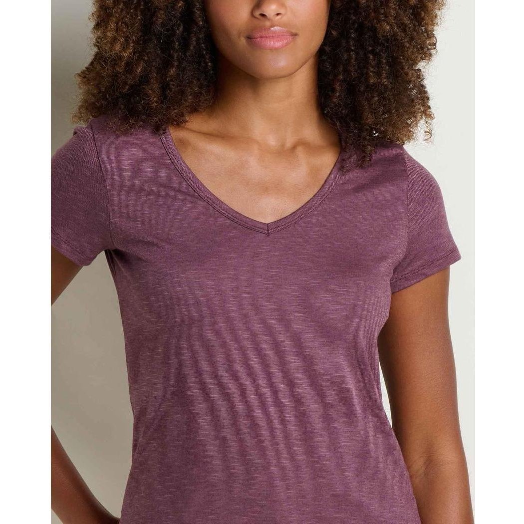 A front view of the Toad & Co Women's Marley II Short Sleeve Tee in Earth color on a model with curly hair against a light background.