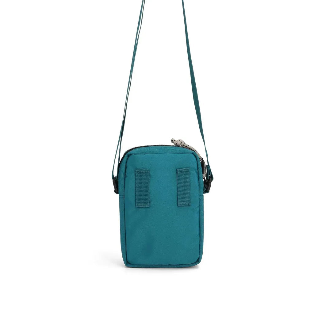 Topo Designs Mini Shoulder Bag in Huckleberry color shown from front with adjustable shoulder strap against white background.