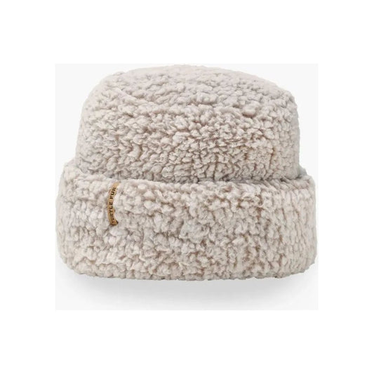 A front view of the Turtle Fur Comfort Lush Après Tort hat in Black with a small gold tag on the brim against a white background.