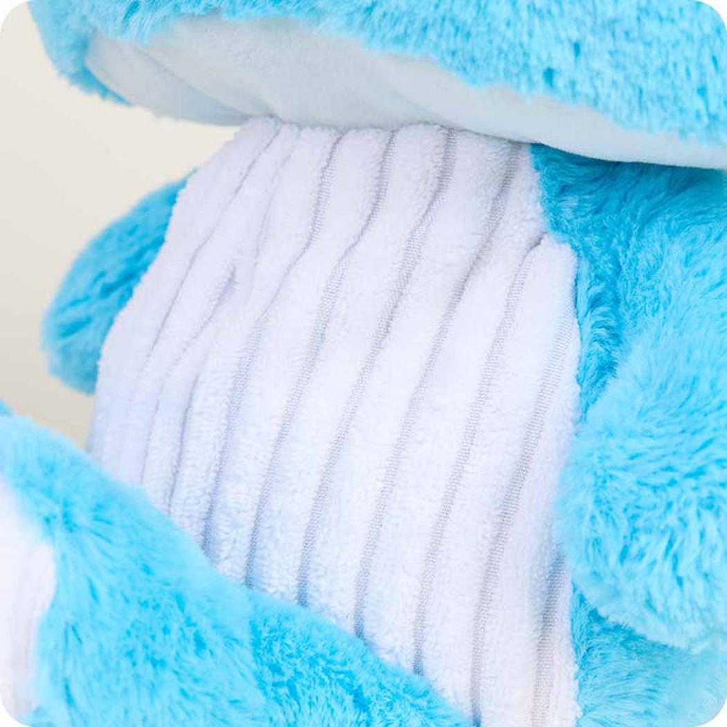 Close-up of the Warmies Blue Mushroom showing the soft blue fur and white ribbed interior against a light background.