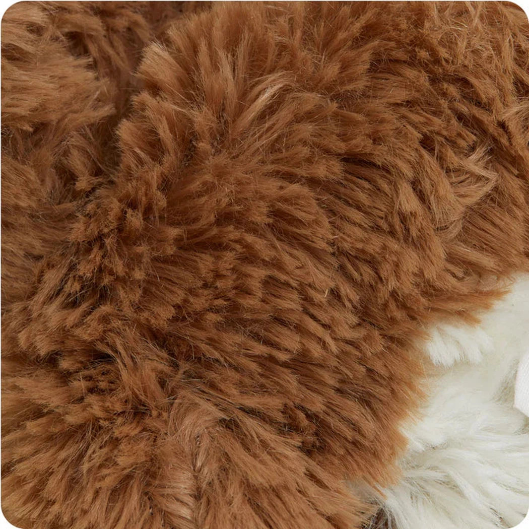 Close-up of the Warmies Cow showing its brown fur texture and white accents.