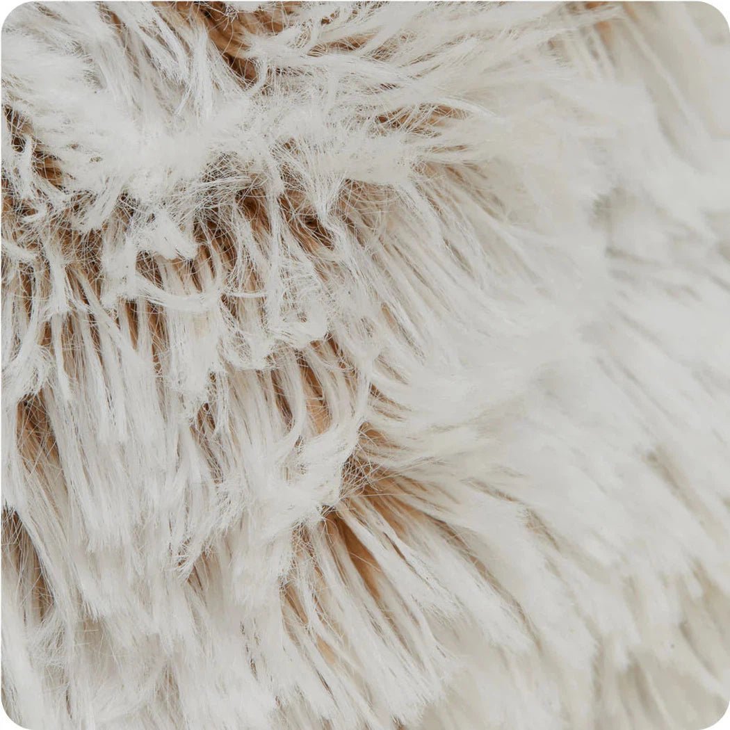 Close-up of the Warmies Hamster Junior showing its fluffy, light-colored fur texture.