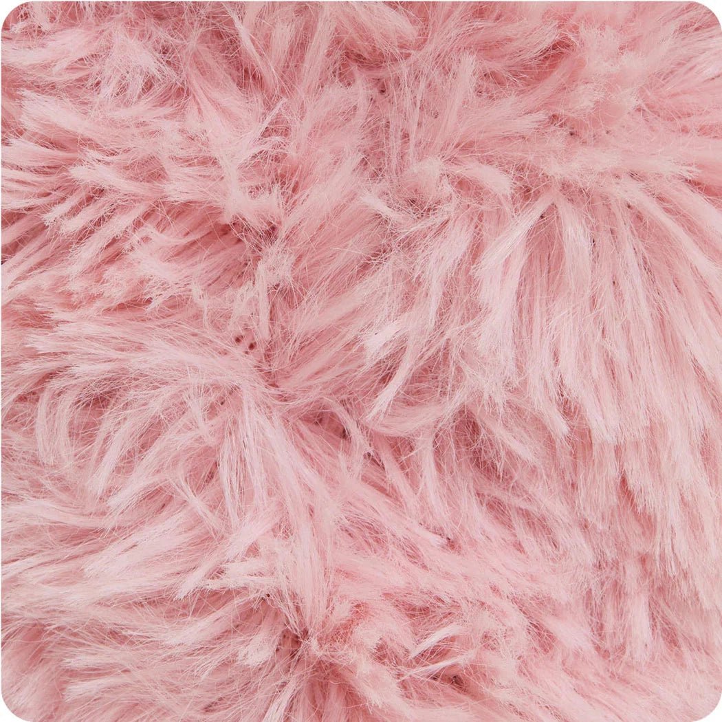 A close-up of the Warmies Pig Junior in soft pink, showing its fluffy texture and soft, plush appearance.