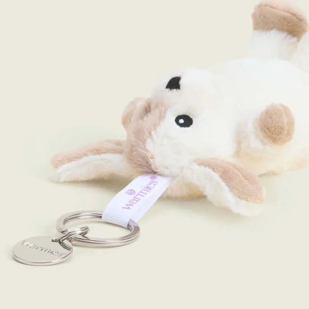 A close-up of the Warmies Puppy Keyring with a white background and a metal key ring attached.