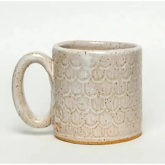 A front view of the White Squirrel Clayworks Classic Owl Design Handmade, in Ohio, Ceramic White 10oz Mug with a textured, scalloped pattern against a plain white background.
